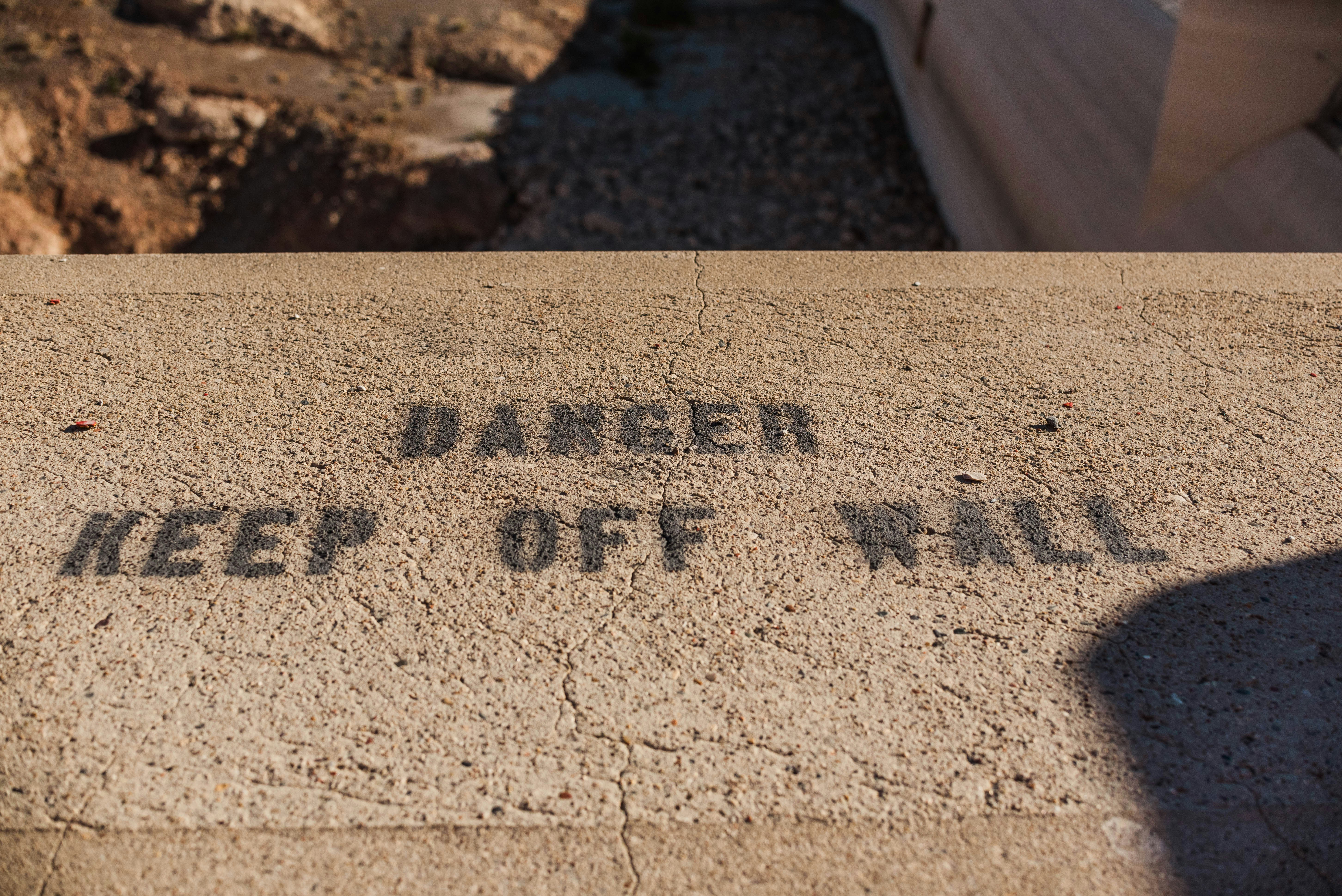 a sign that reads danger keep off all