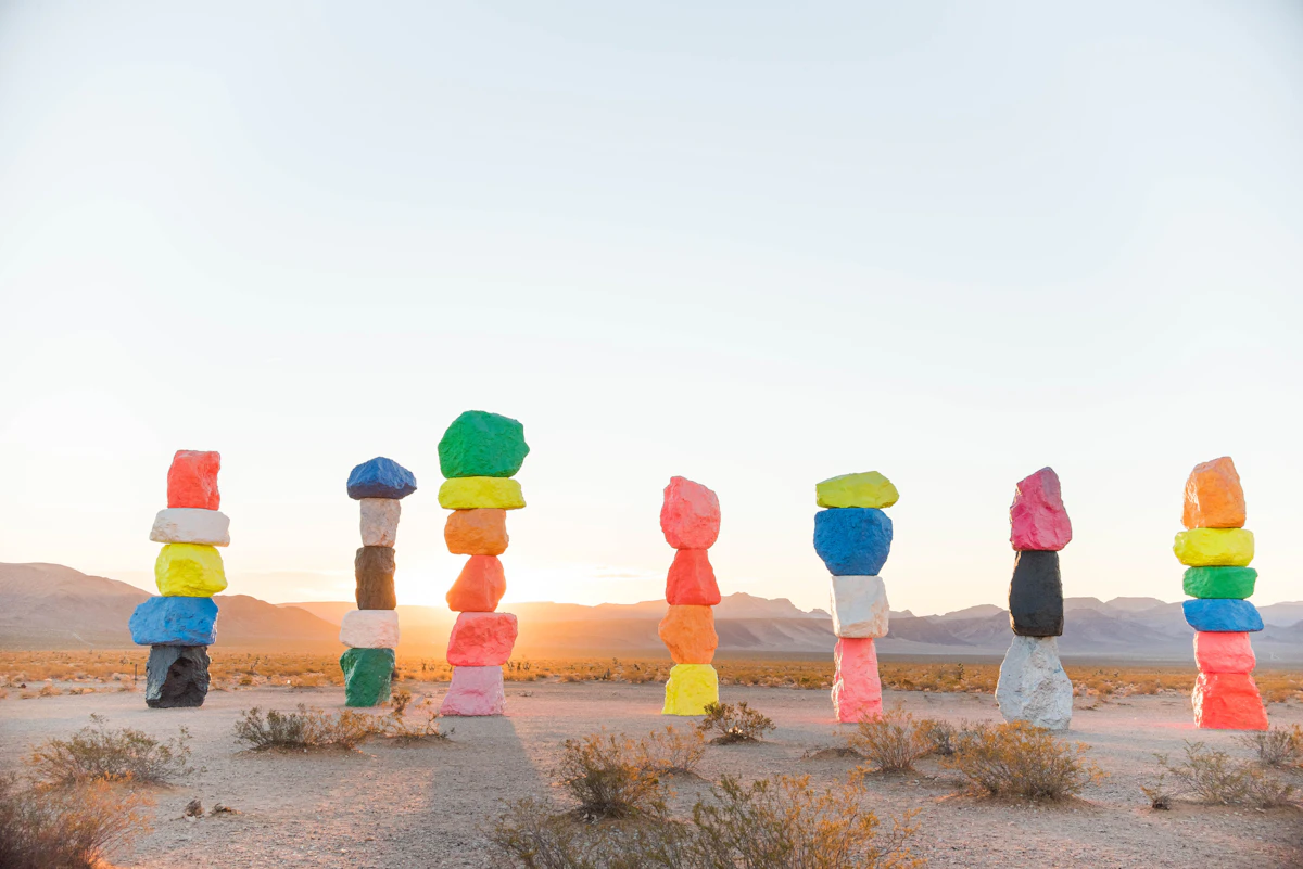 Seven colored stones stacked from red to violet, the chakra spectrum