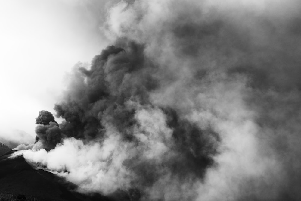 a black and white photo of a large plume of smoke