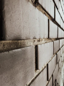 Close-up of a detailed 3D printed brick wall with textured, lifelike depth and color variations.