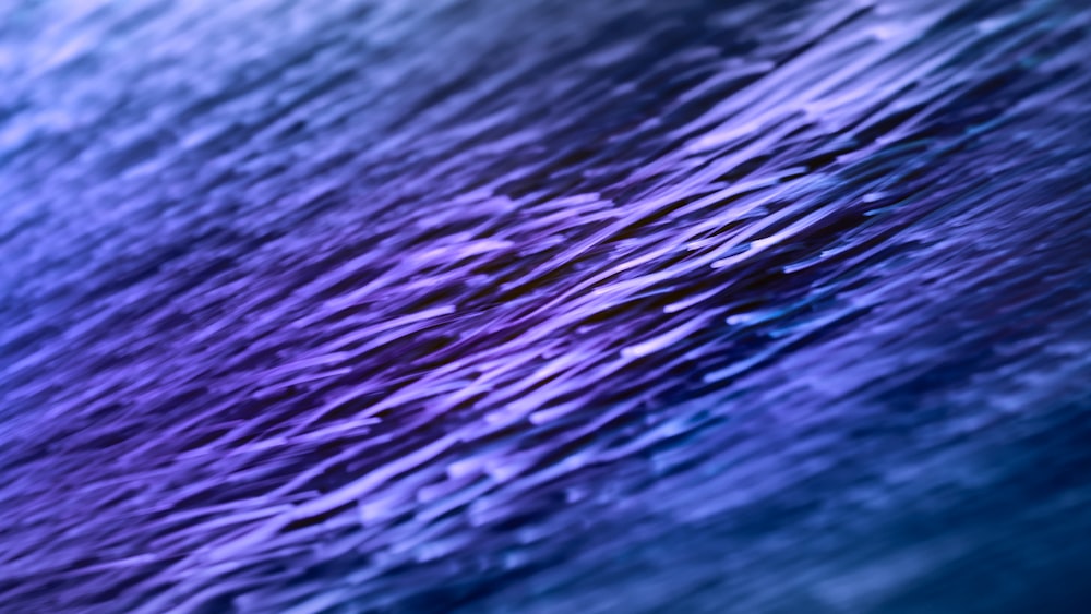 a close up of a blue and purple background
