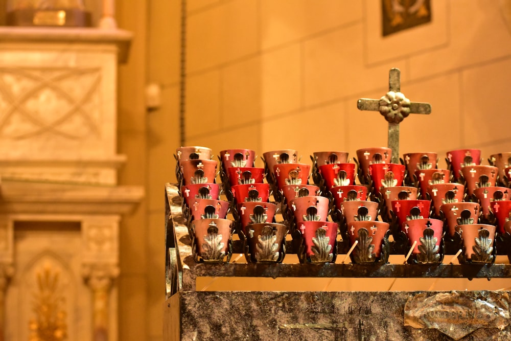 a bunch of red cups sitting on top of a table