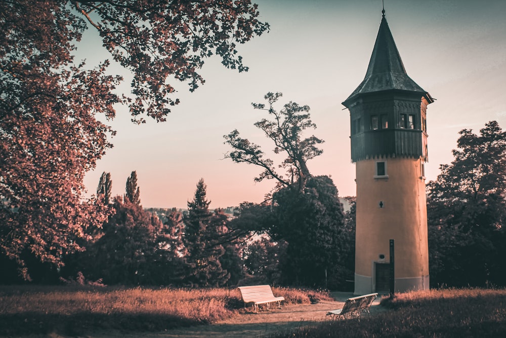 a tall tower with a clock on the top of it