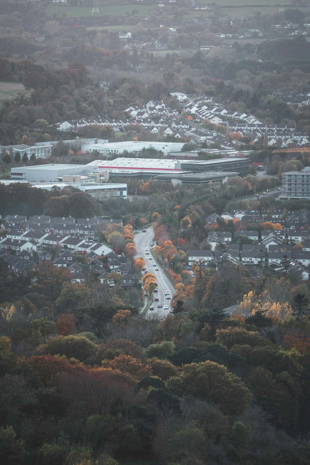 an aerial view of a city with lots of trees