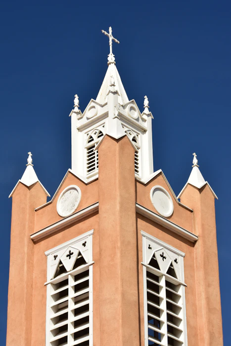 a church steeple with a cross on top