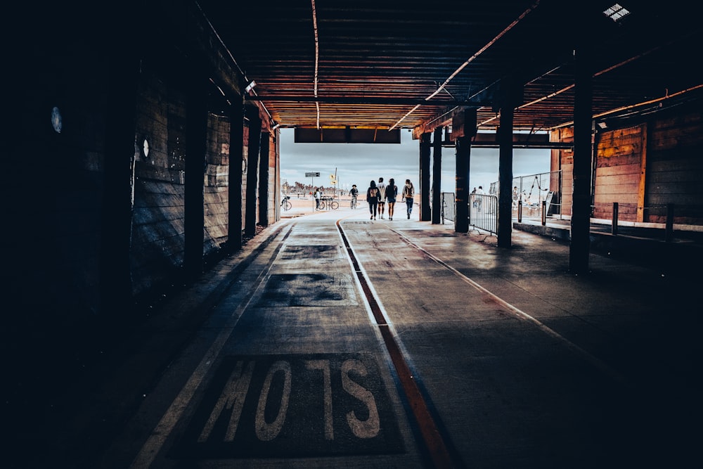 a group of people standing in a tunnel