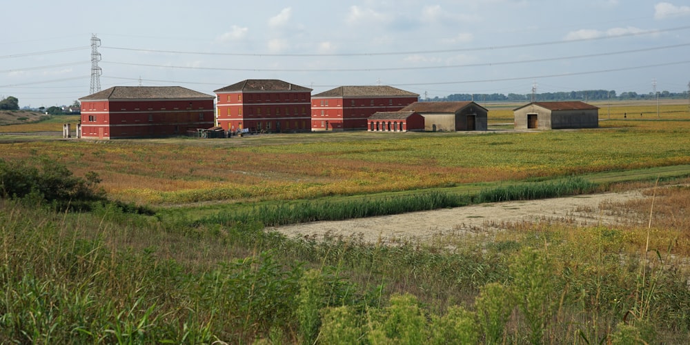 a large field with some buildings in it