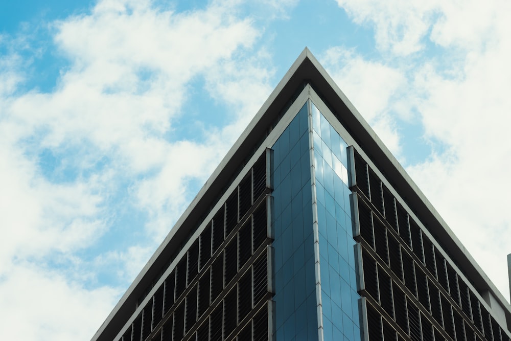 a very tall building with a sky background