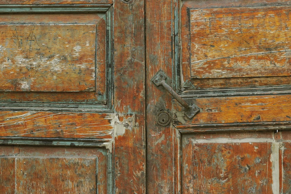 a close up of an old wooden door