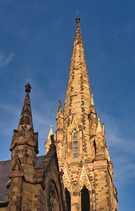 a very tall building with a clock on it's side