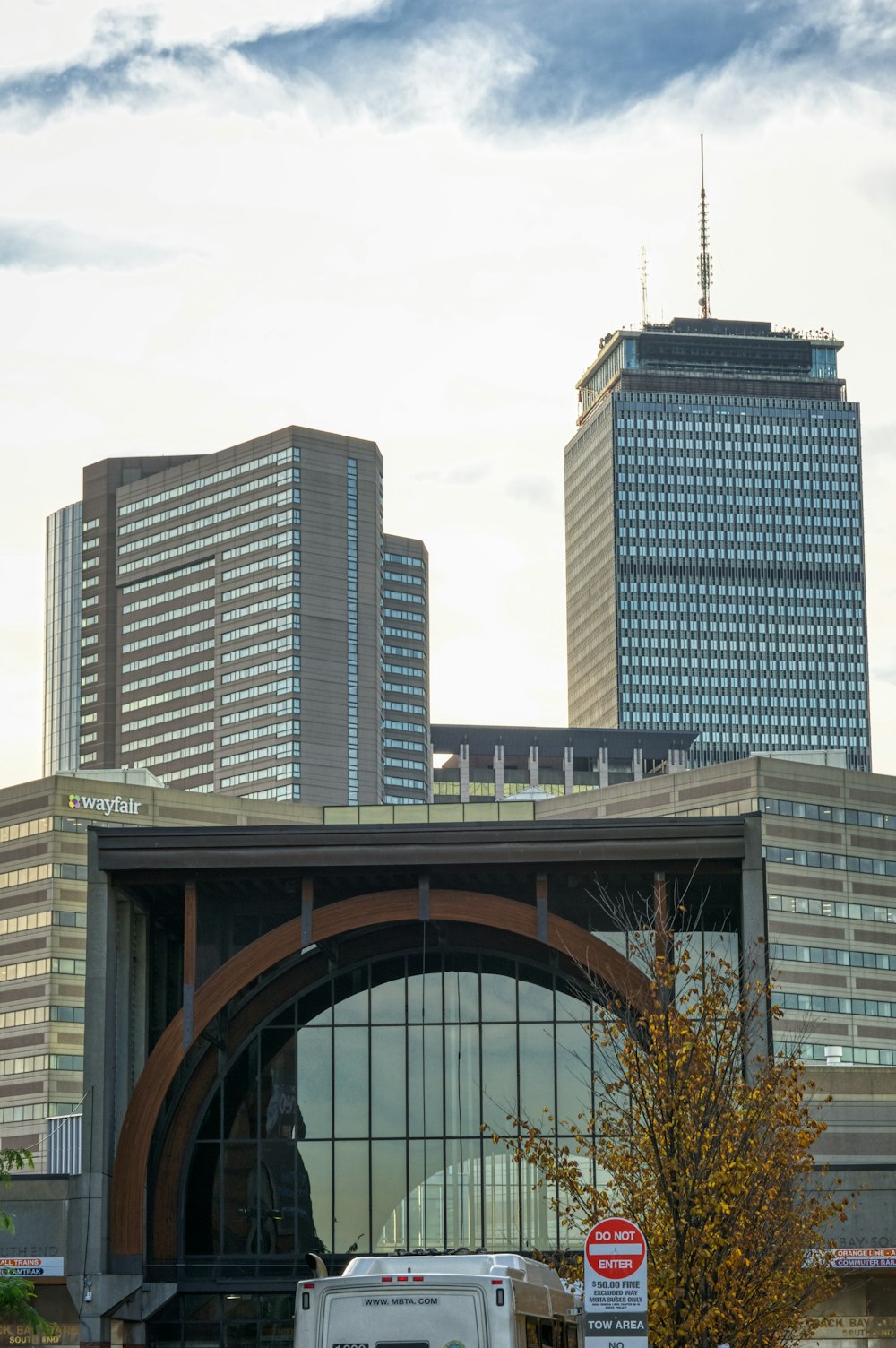 a truck is parked in front of a large building