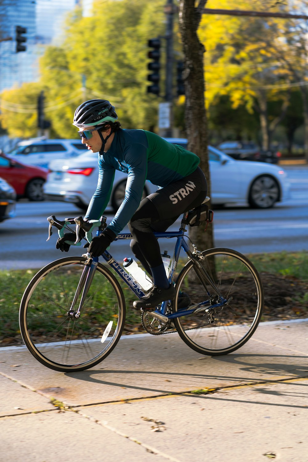 a person riding a bike on a city street