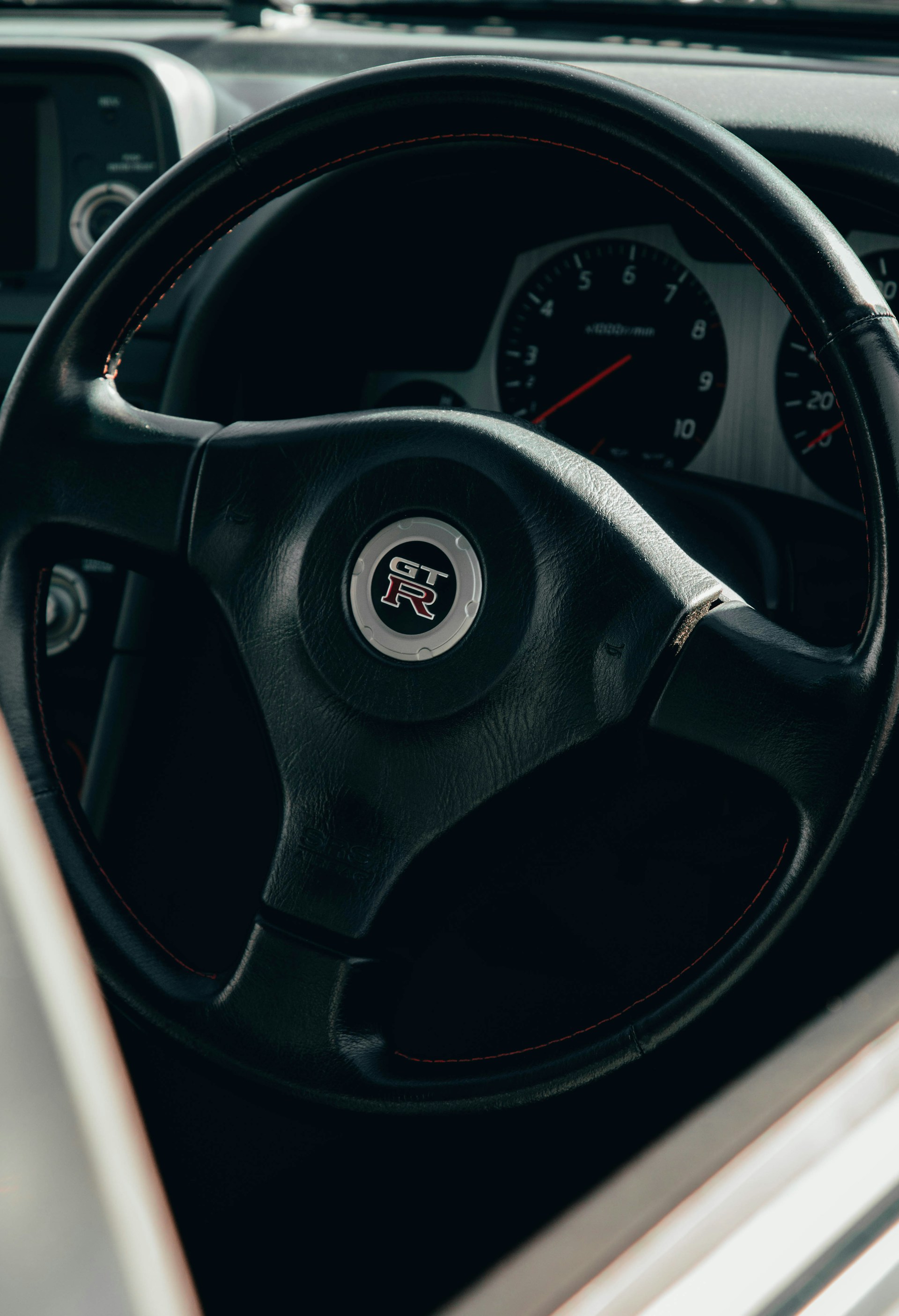 a steering wheel and dashboard of a car