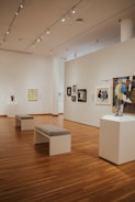 Wide shot of a contemporary art gallery with spotlights.