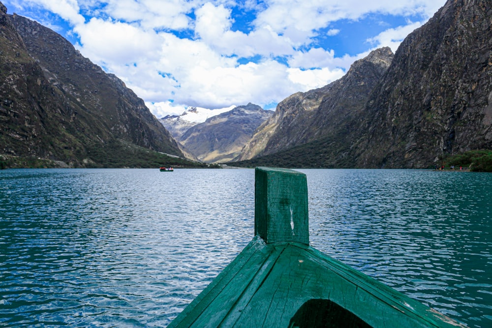 a view of a body of water with mountains in the background