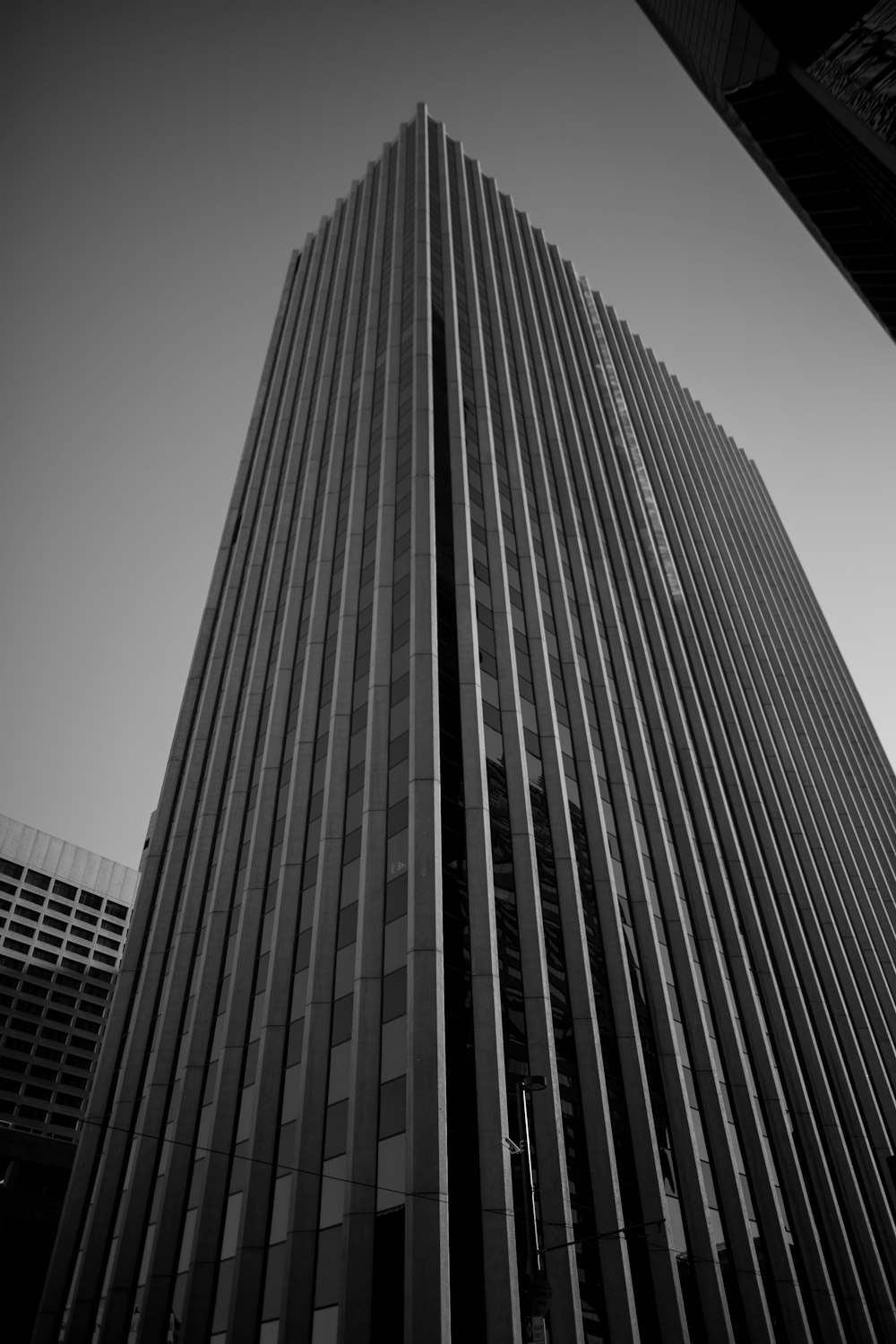 a black and white photo of a tall building