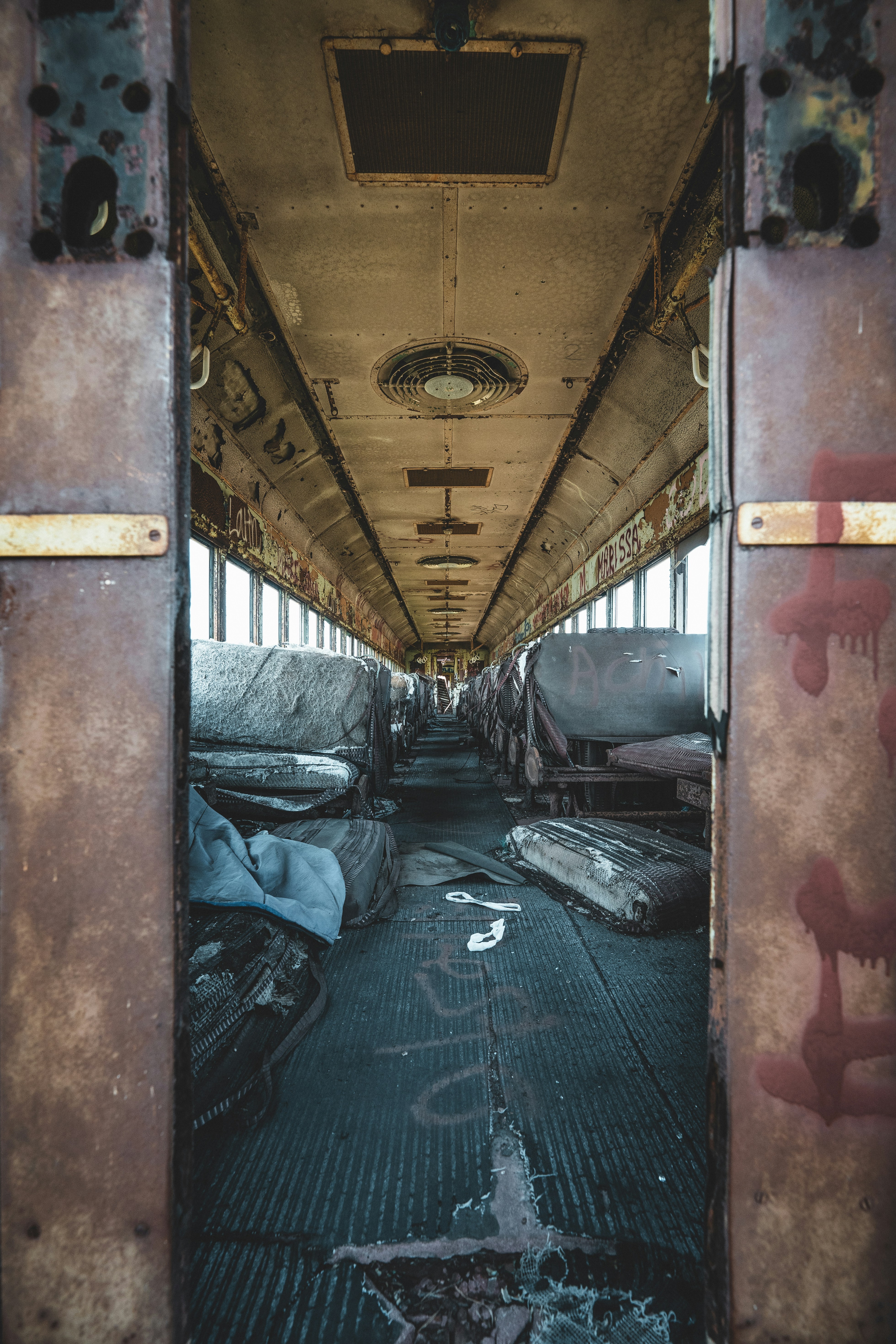 A long hallway with a bunch of mattresses on the floor photo – Free