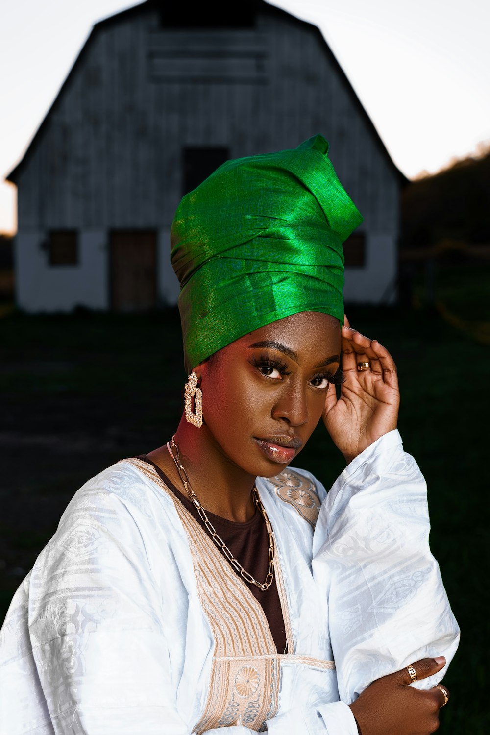a woman with a green turban on her head