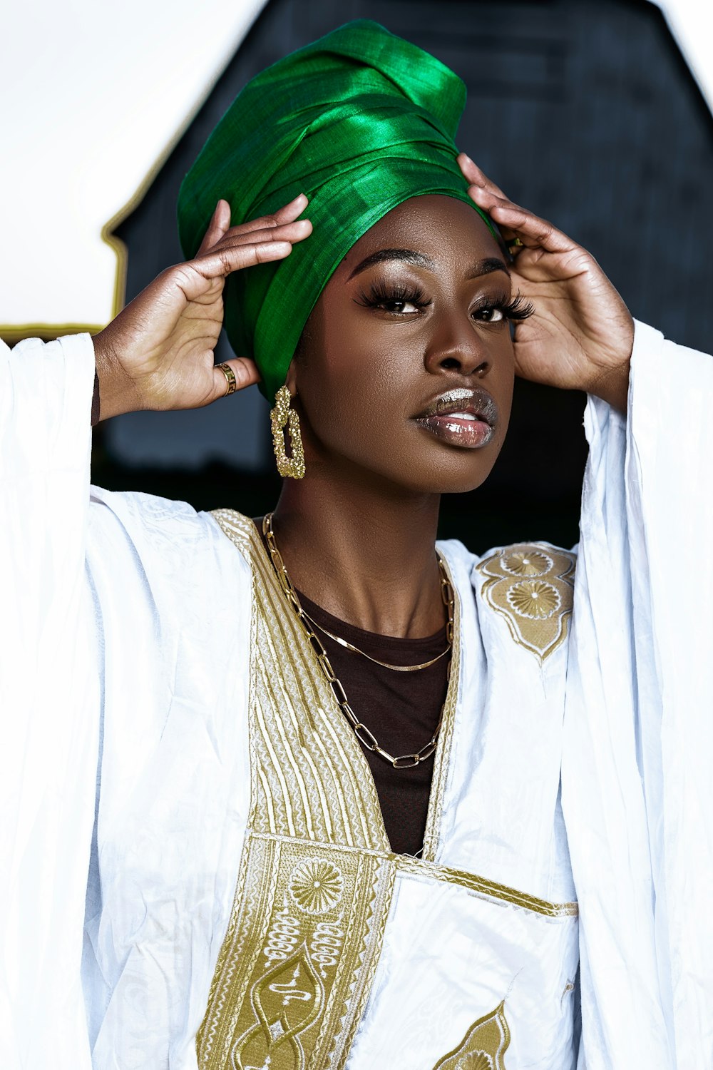 a woman with a green turban on her head