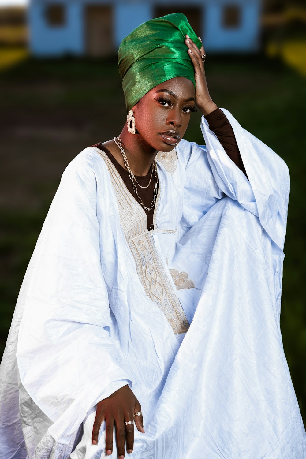 a woman with a green turban on her head