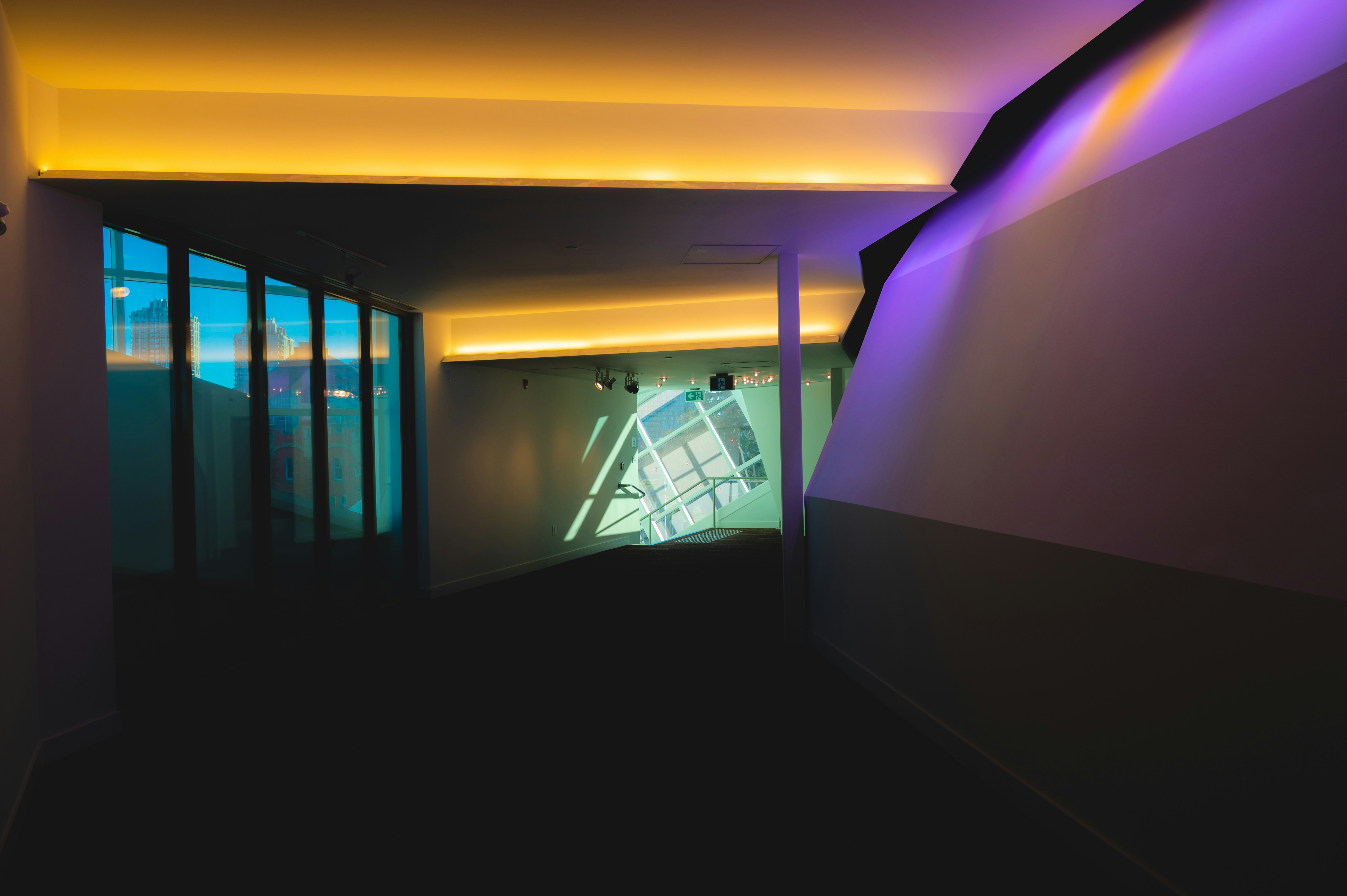 a dimly lit hallway leading into a building