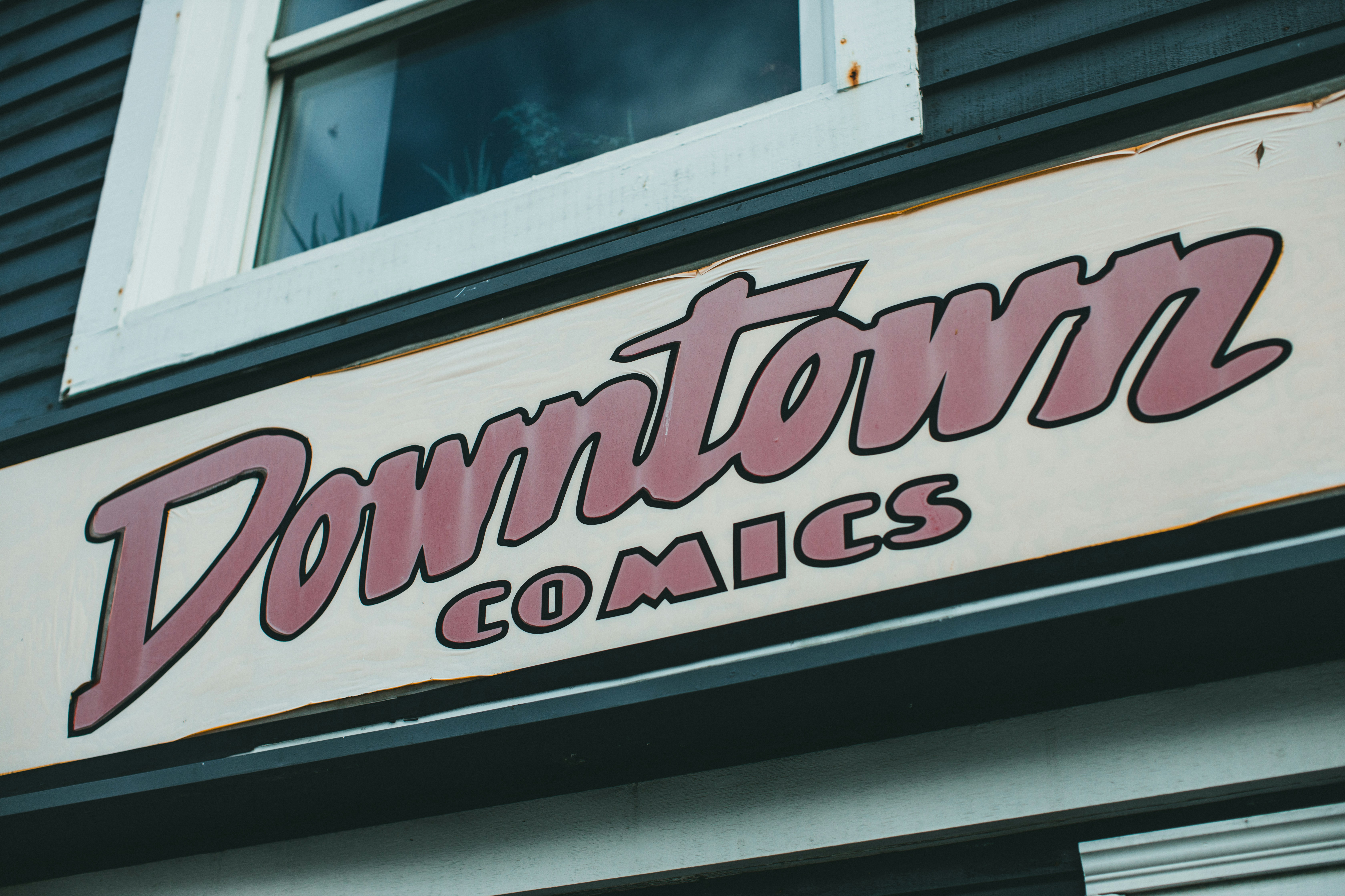 a close up of a sign on the side of a building