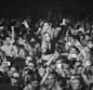 a woman standing in front of a crowd of people