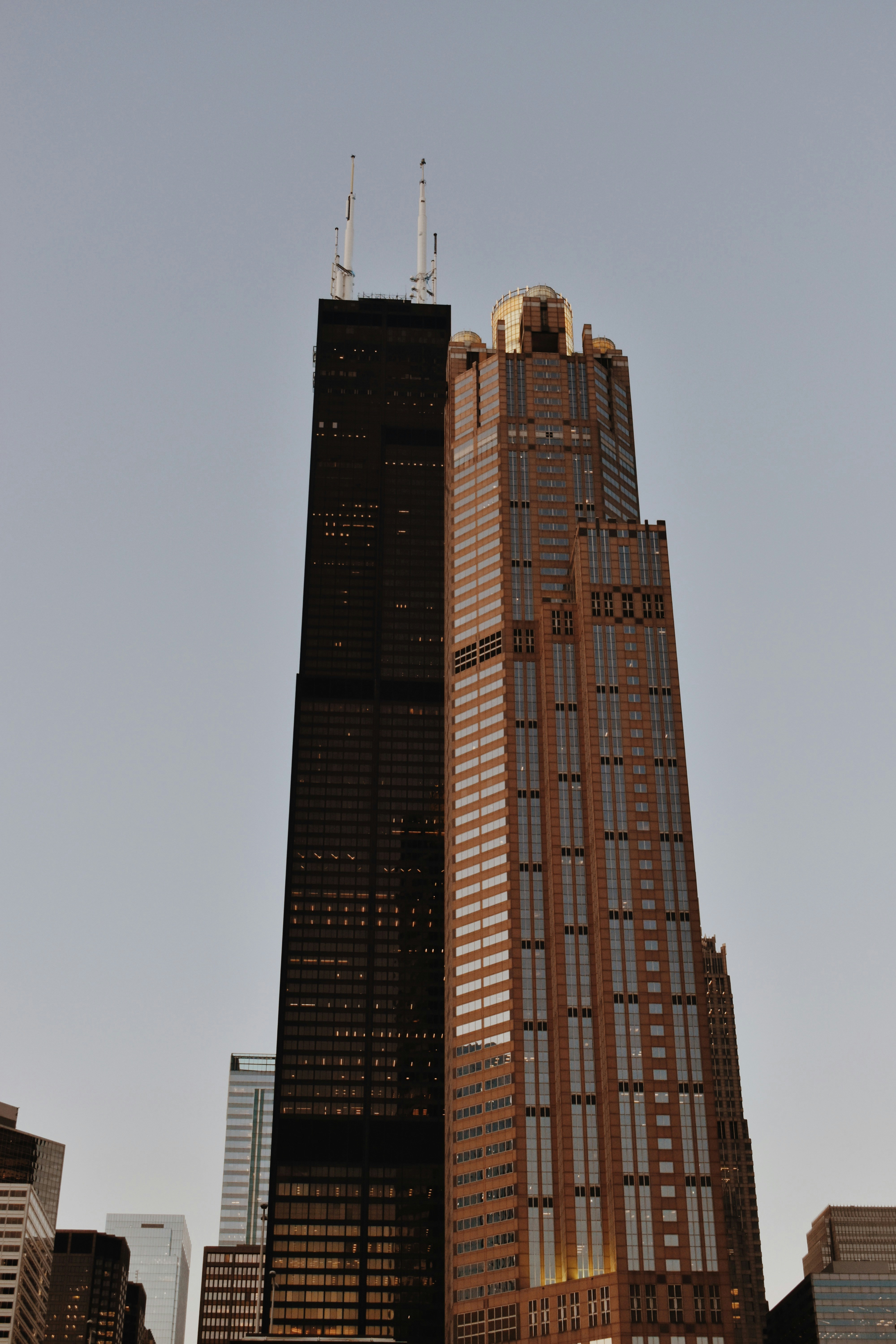 a very tall building towering over a city