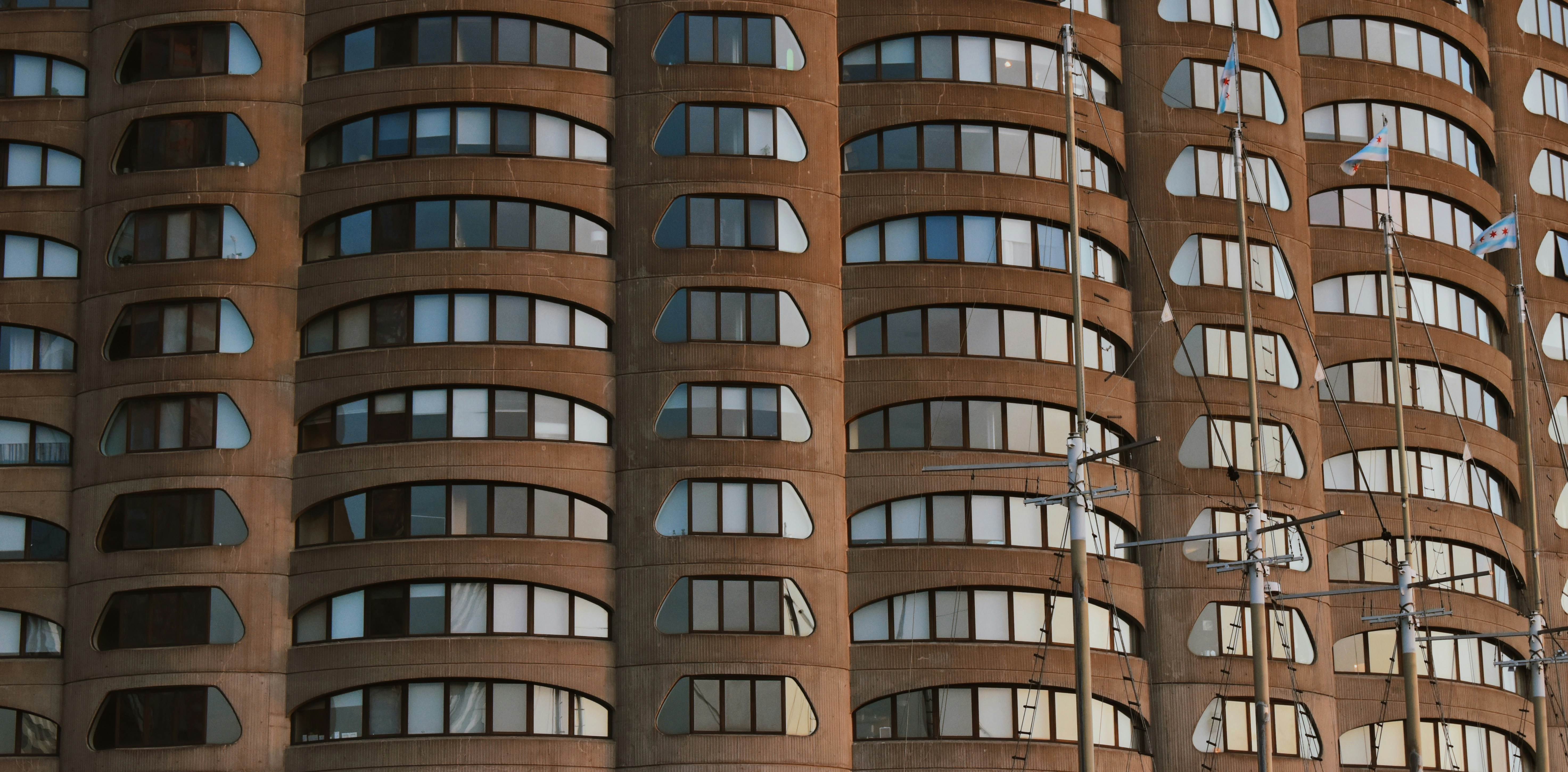 a tall building with lots of windows next to a traffic light
