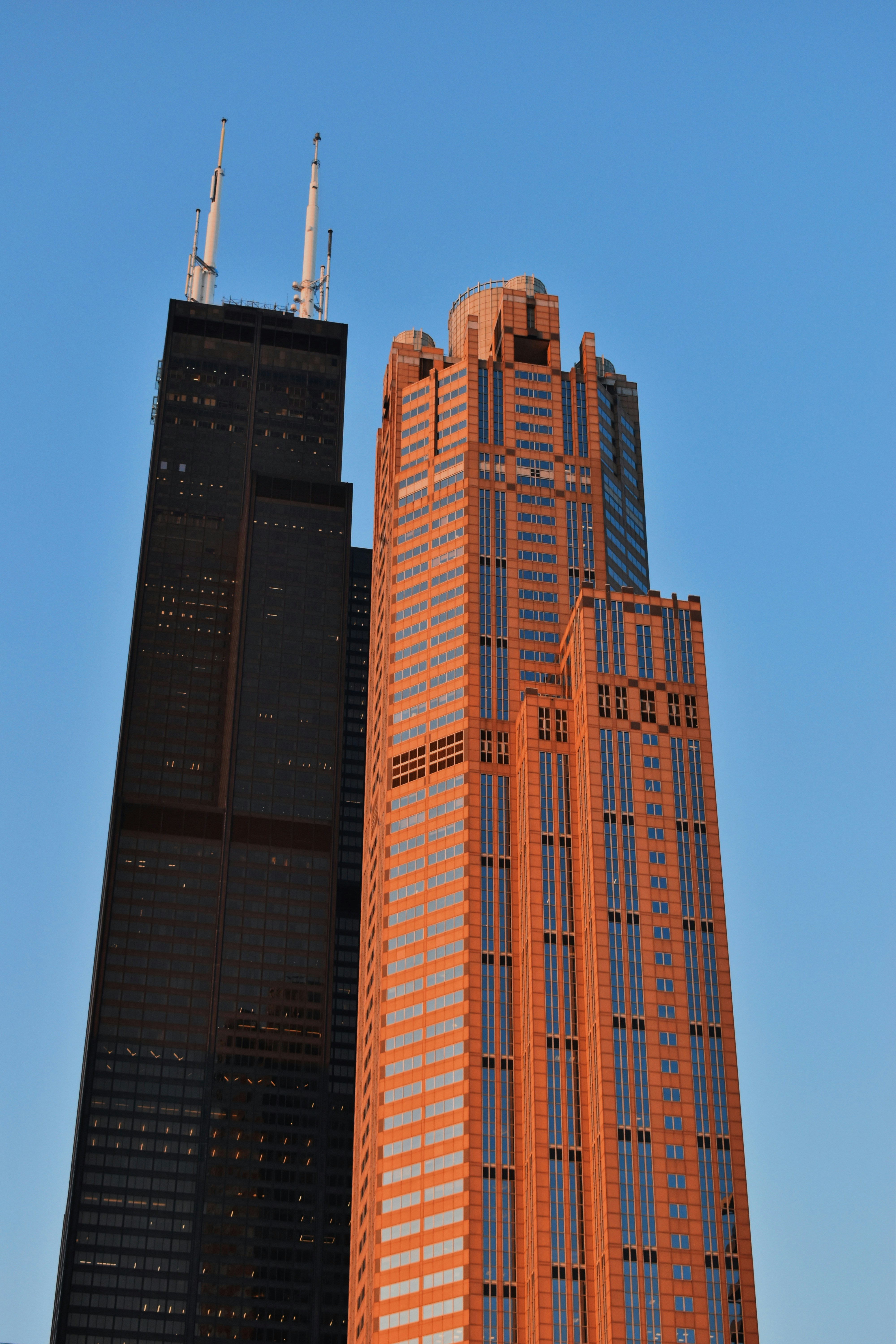 a very tall building with a clock on it's side
