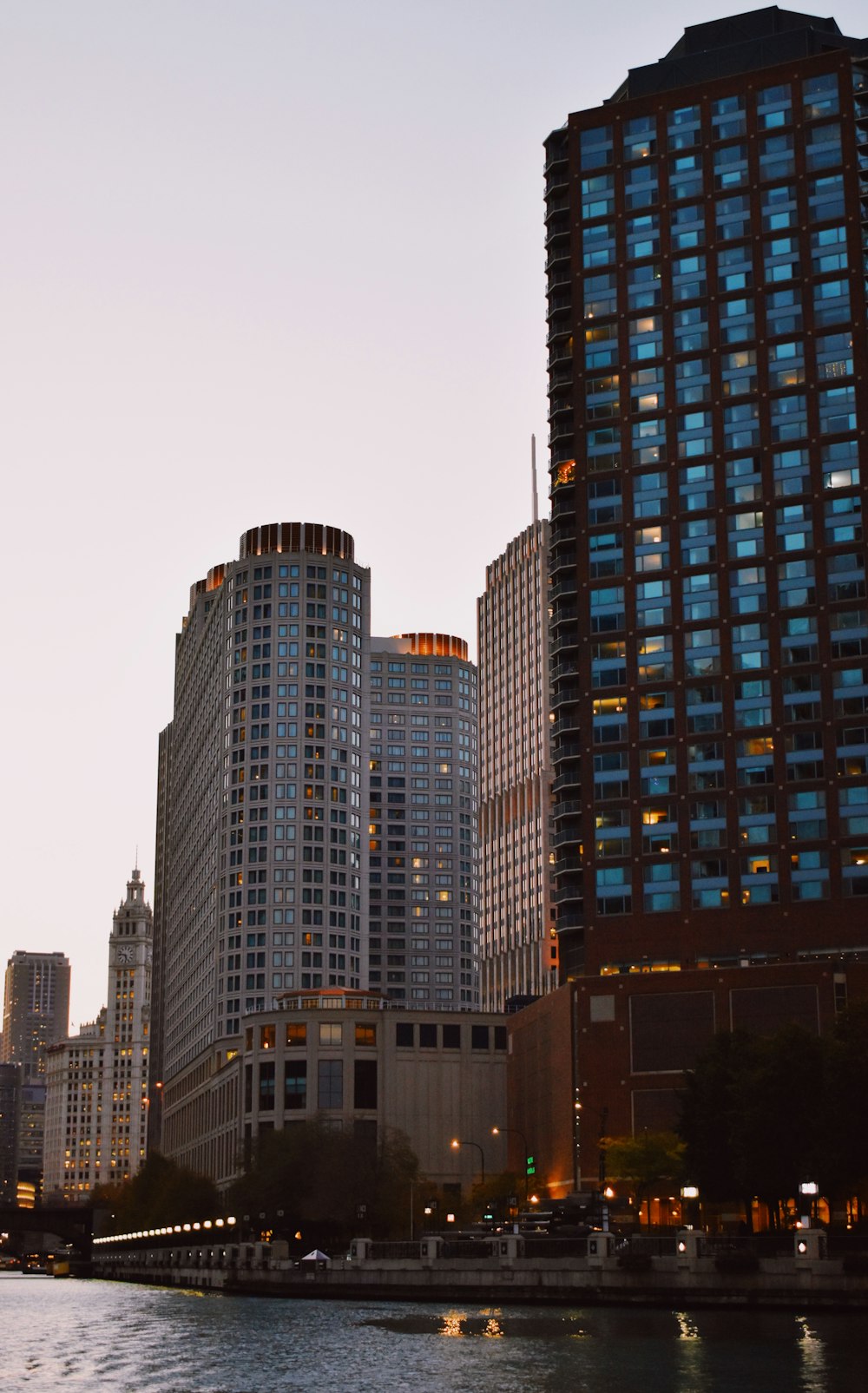 a body of water in front of tall buildings