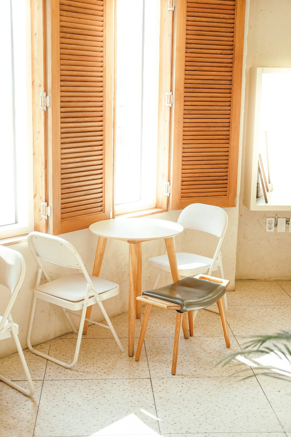 a chair sitting in front of a window