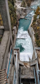 an aerial view of a river running through a city