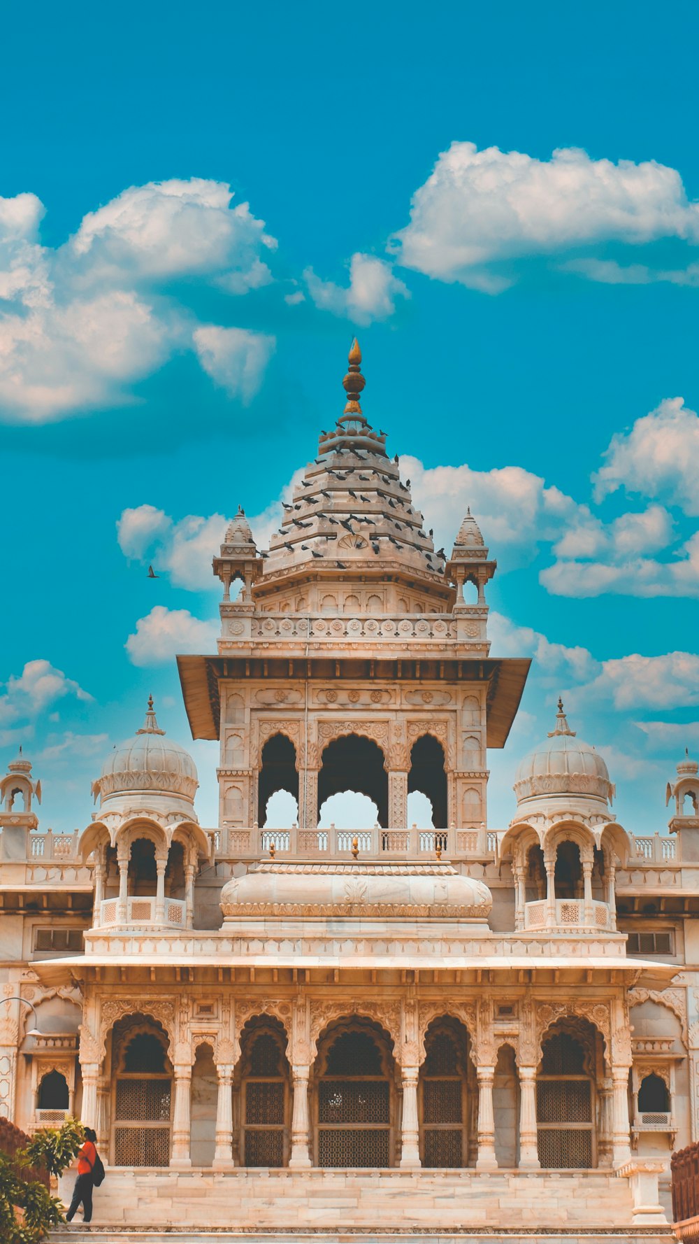 a large white building with a sky background