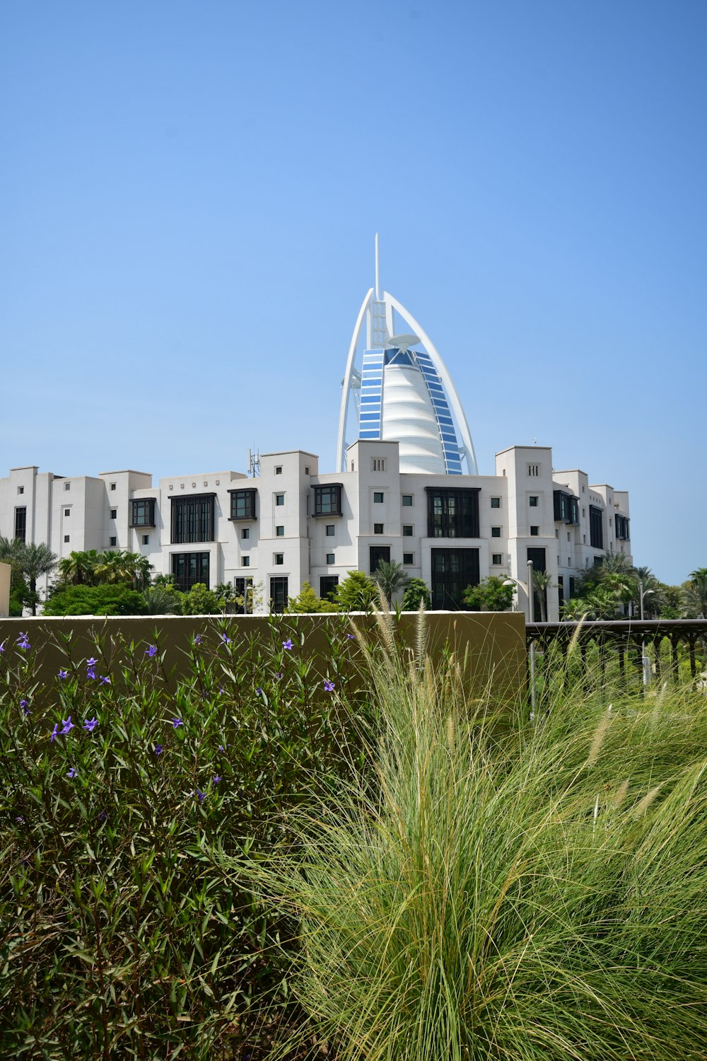 a tall building with a very tall tower in the background