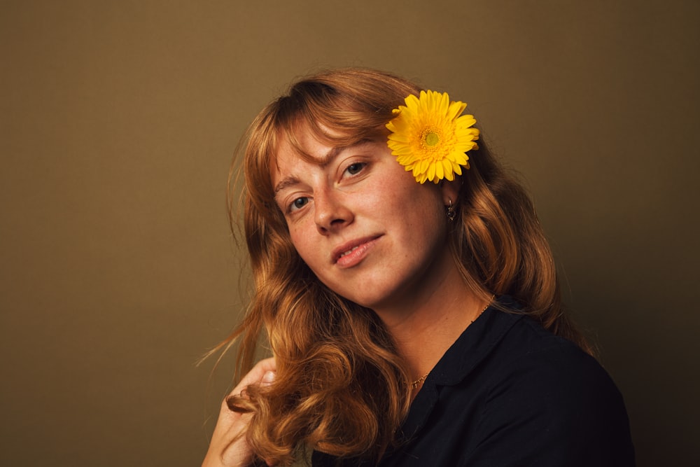 a woman with a flower in her hair