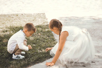 a little boy and a little girl playing with each other