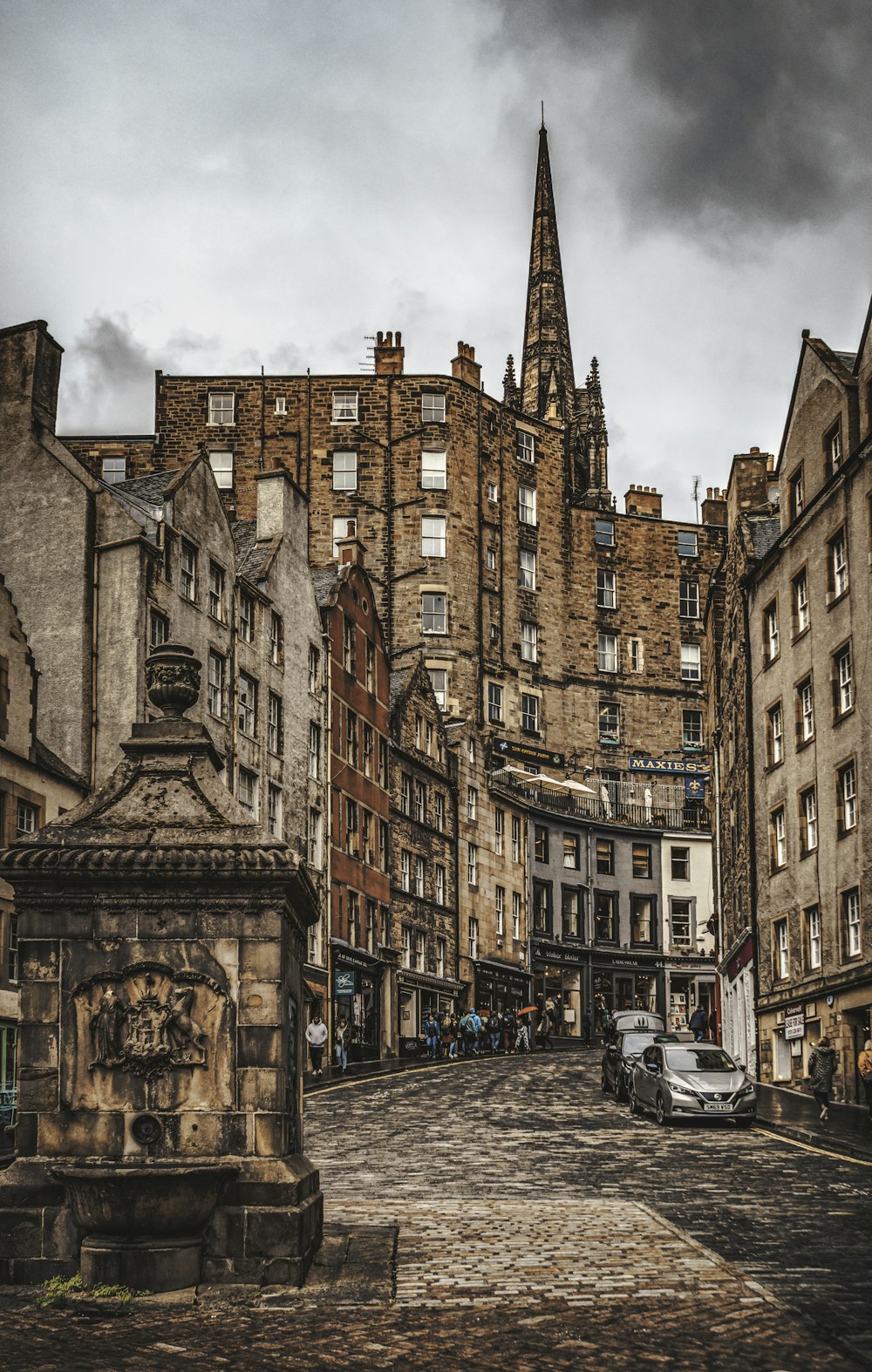 a city street with a clock tower in the background