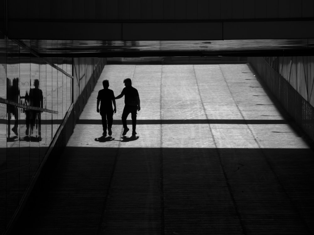 a couple of men standing next to each other