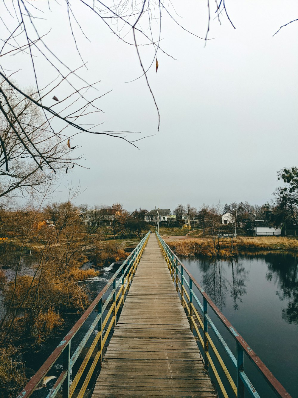 a wooden bridge over a body of water