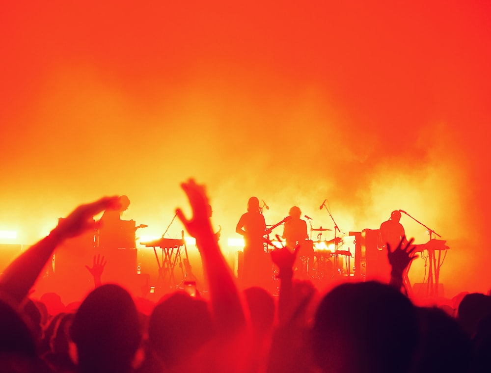 a group of people standing on top of a stage