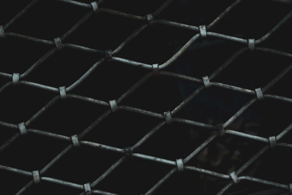 a close up of a metal grate with black squares