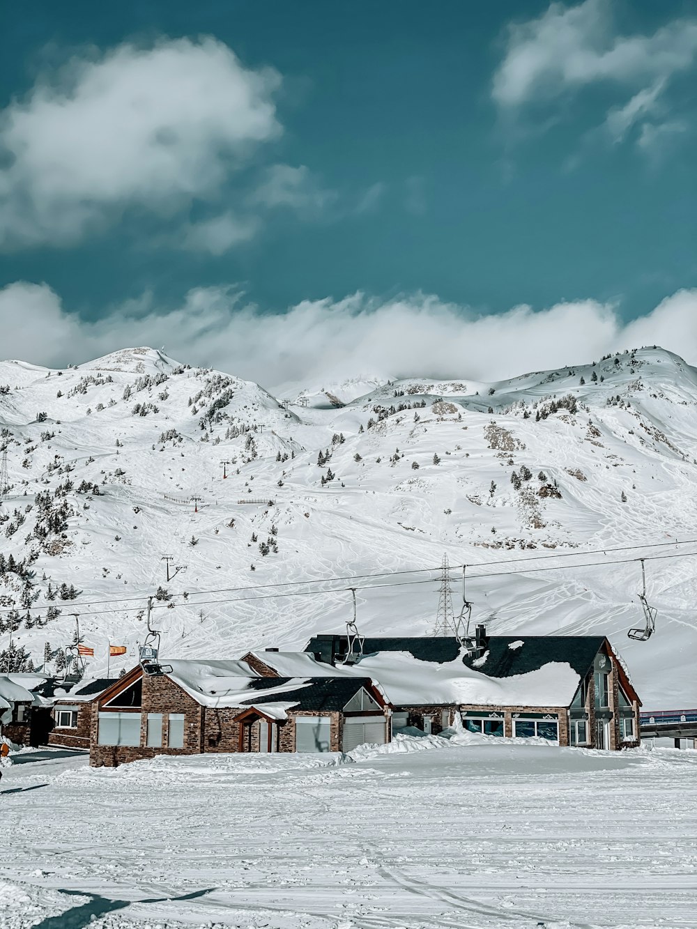 a ski resort with a mountain in the background