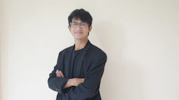 A confident business leader presenting psychosocial risk solutions to company executives.