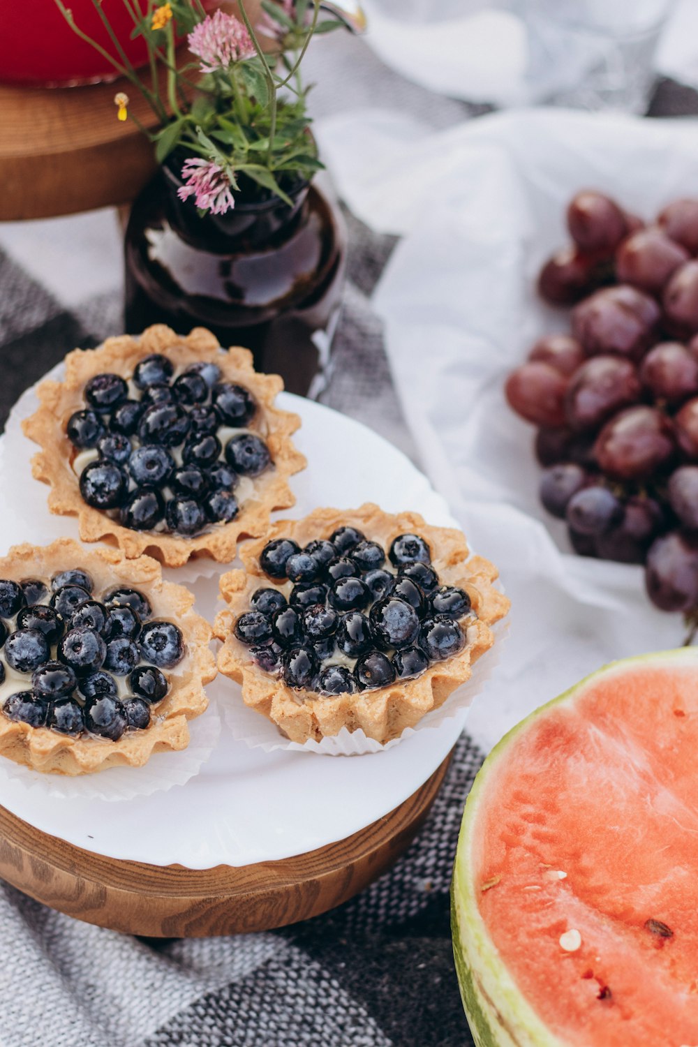 a plate of blueberries and watermelon on a table