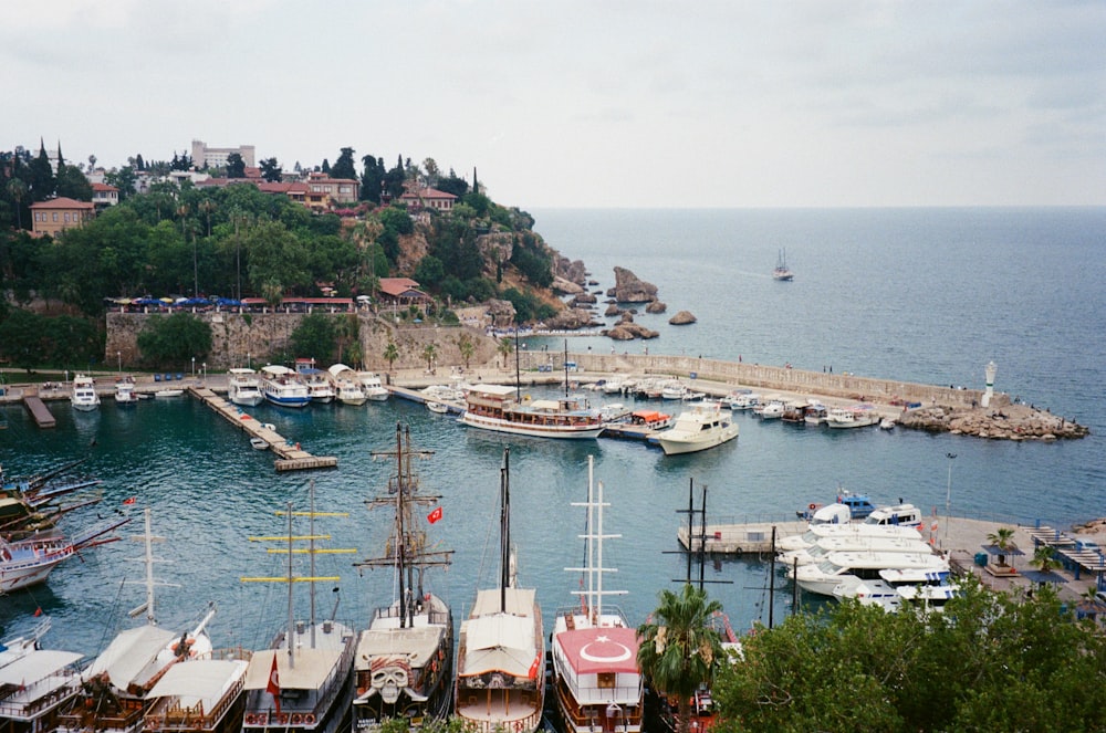 a harbor filled with lots of boats on top of a body of water