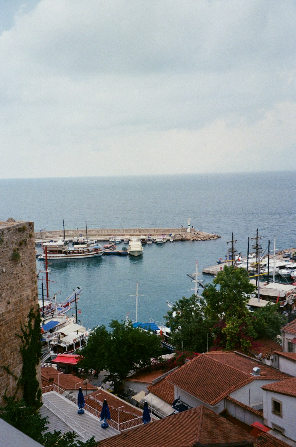 a harbor filled with lots of boats on top of a body of water