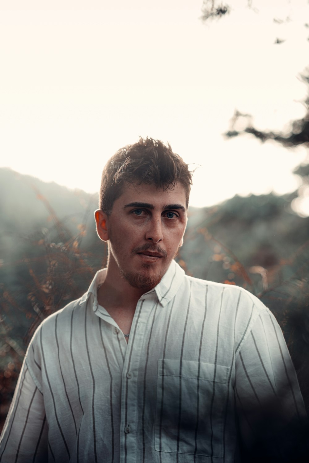 a man standing in a field of tall grass