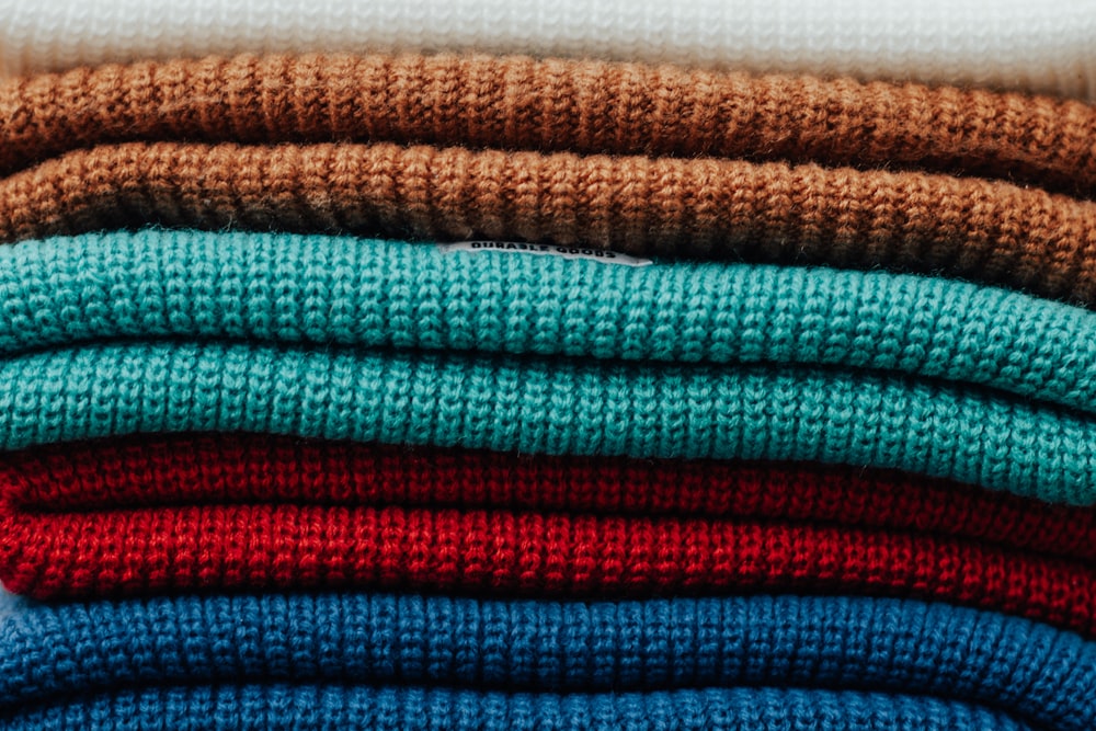 a stack of sweaters sitting on top of each other
