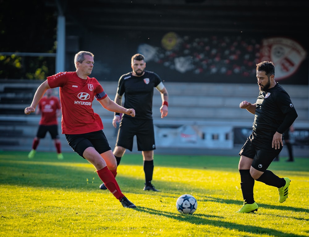 a group of men playing a game of soccer